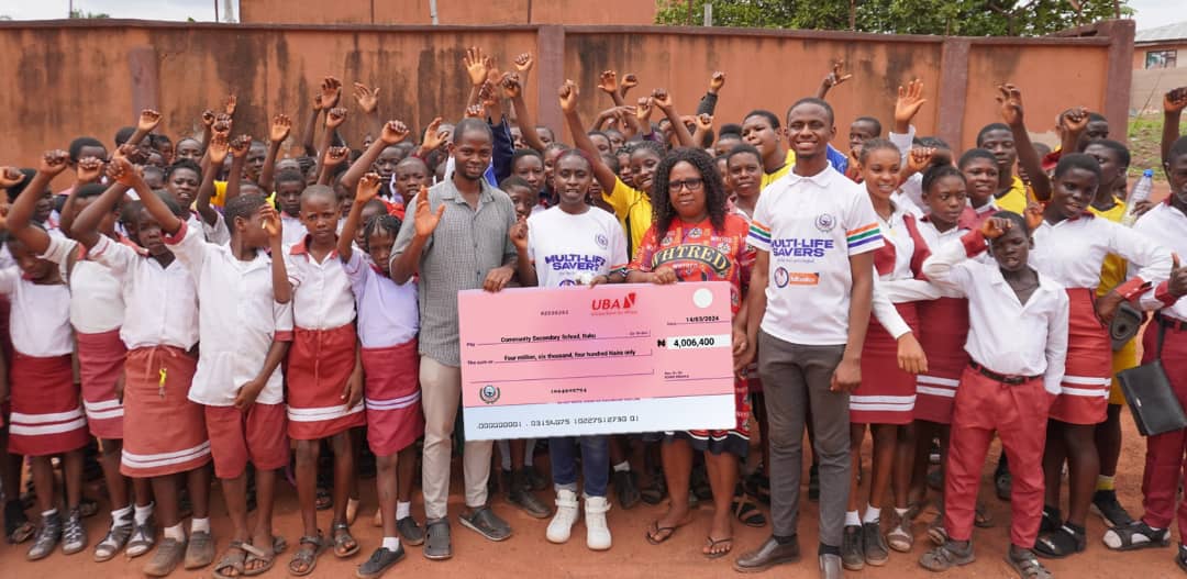 Multi-Life Savers presents a cheque for school fee payments (N2,425,000) at Chinoby Secondary School, Agbaogugu